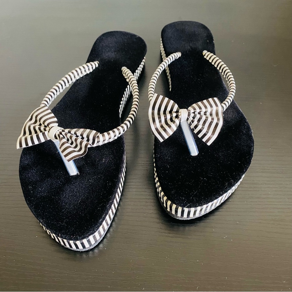 Black and white slippers. Size 8.